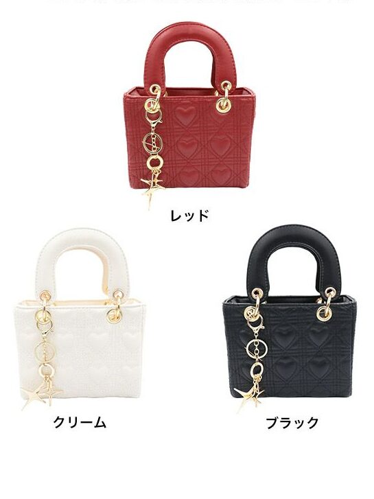 可愛いハート型のキルティングに大きめチャームがセットになったハンドミニバッグ